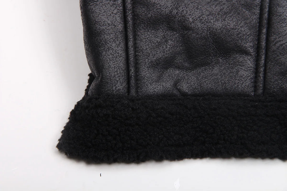 Black winter faux leather dog coat featuring a black fleece lining and trim.