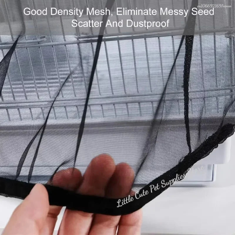 A hand is holding a black mesh cover for a bird cage, demonstrating its good density and dustproof features.
