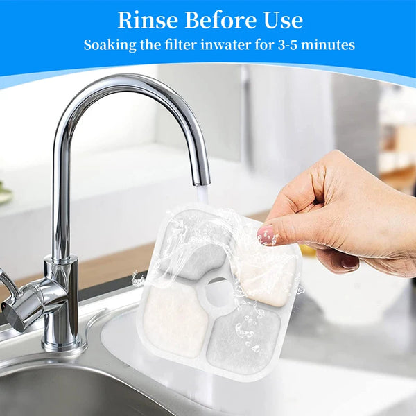 A hand is rinsing an activated carbon replacement filter for a pet water fountain under a faucet.