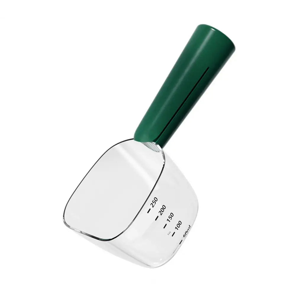 A green and clear 2-in-1 pet food measuring scoop with a spoon for wet food.