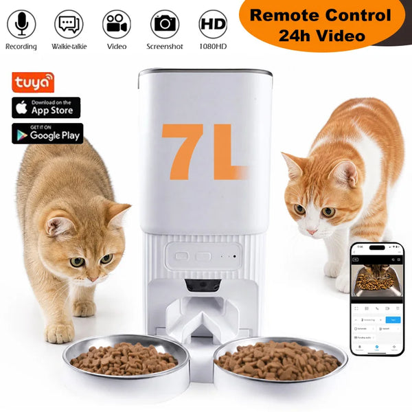 A white smart pet feeder with an HD camera is shown next to a cat and two stainless steel bowls of dry food.