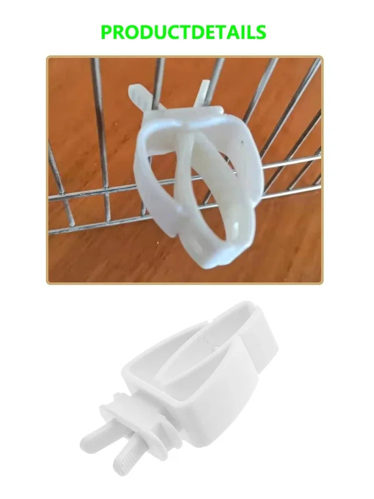 A white adjustable bird food clip is shown resting on a wire grid.