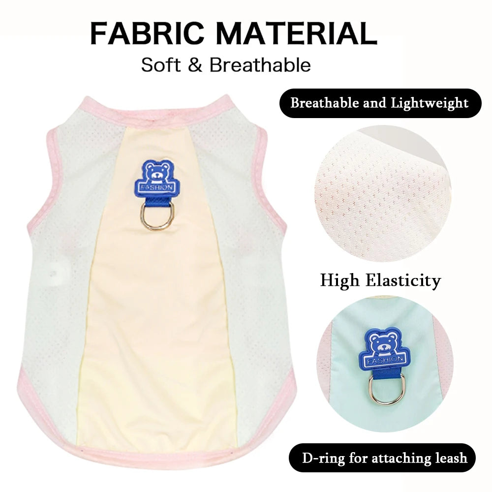 A white and pink fabric dog vest with a blue D-ring for attaching a leash, highlighting soft, breathable, and elastic materia