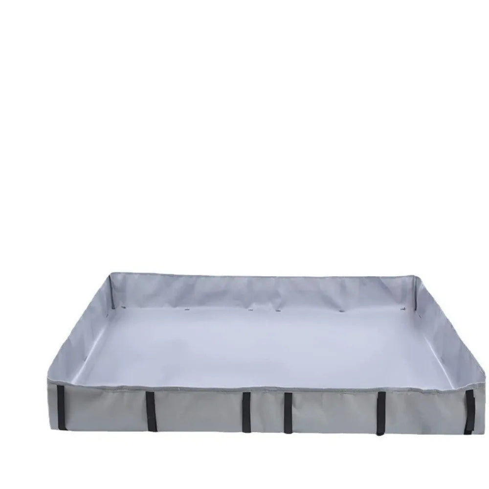 Un sous-couche imperméable gris rectangulaire conçu pour les cages d'animaux.