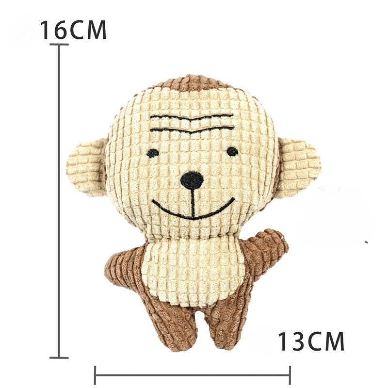 A light brown, textured plush toy shaped like a dog or duck, with a stitched face and brown body.
