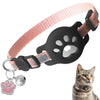 A pink adjustable cat collar with a paw print design and an attached AirTag holder and bell.