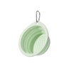 A light green collapsible silicone pet travel bowl with a metal hanging loop.
