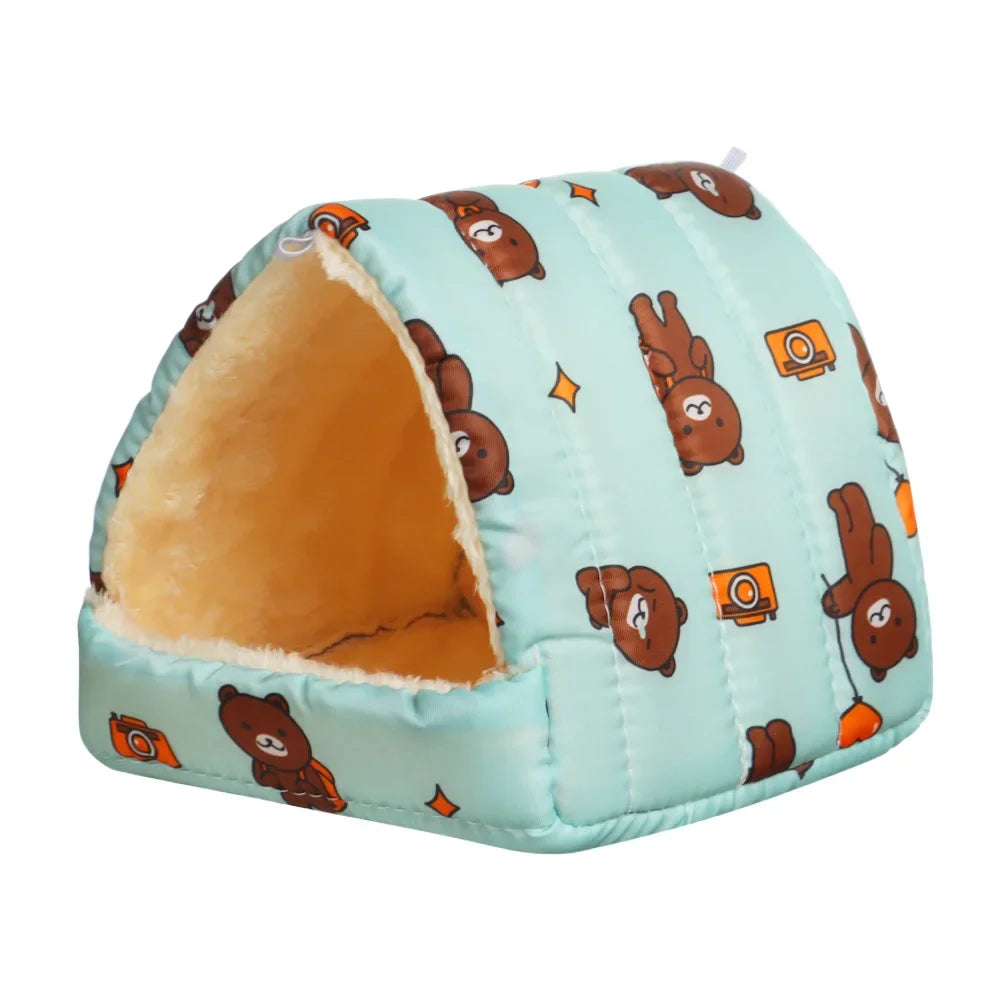 A light blue flannel pet nest bed with a quilted pattern featuring brown bear illustrations and orange accents.