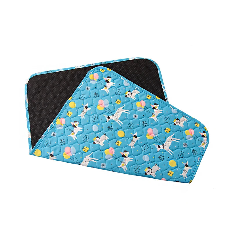 Blue patterned washable non-slip dog training pads with a black cover.