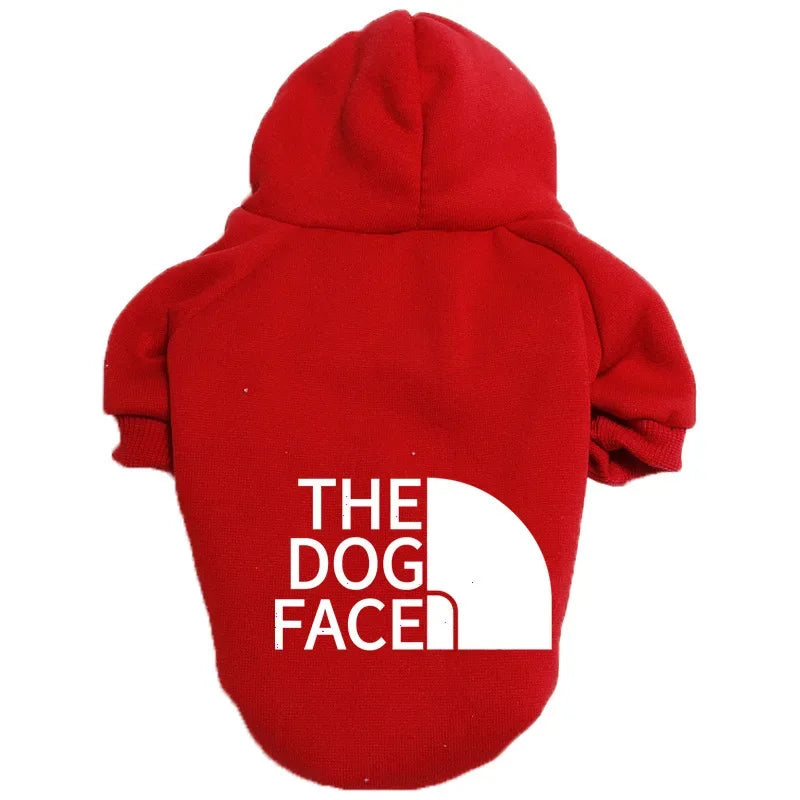 A red cozy fleece pet hoodie with the text THE DOG FACED printed on the back.