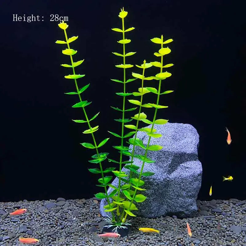 A tall, slender artificial aquarium plant with bright green leaves is displayed on a dark gravel surface.