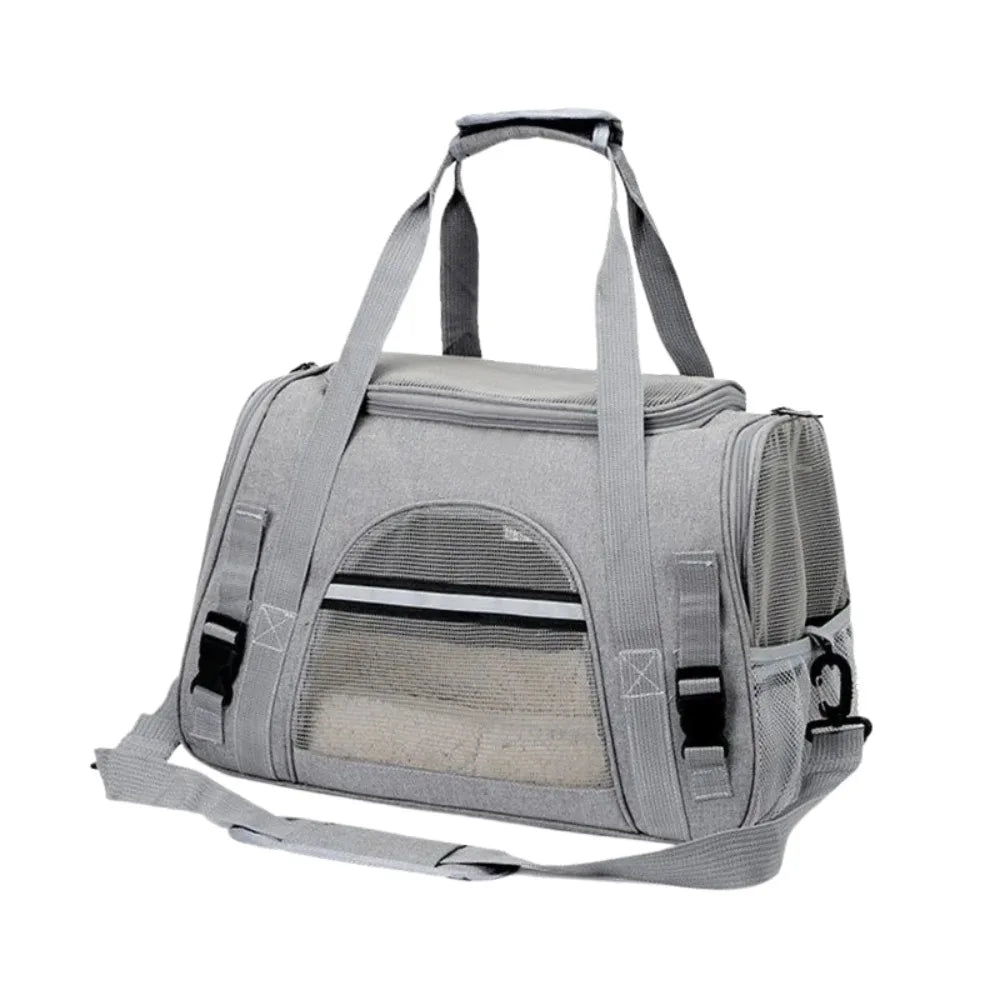 A gray foldable pet travel carrier bag with a breathable mesh window and carrying straps.