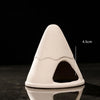 A white ceramic aquarium shrimp hideaway cave shaped like a cone with an entrance.