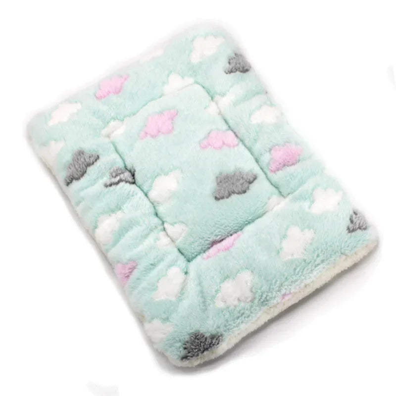 Light blue plush fleece pet blanket or bed mat with white and gray cloud patterns