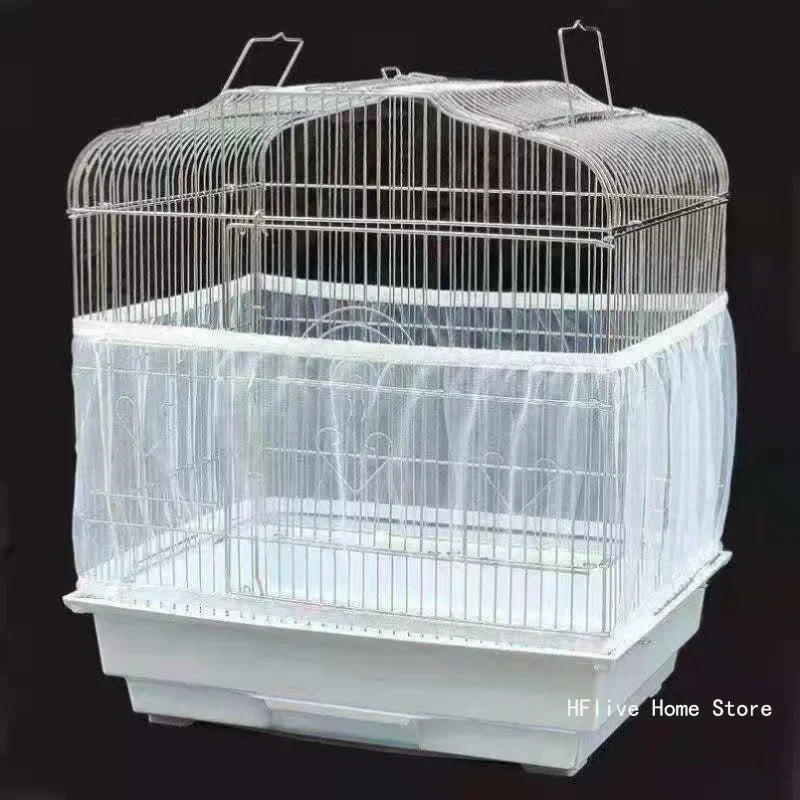 A clear wire mesh bird cage with a protective cover and a white base.