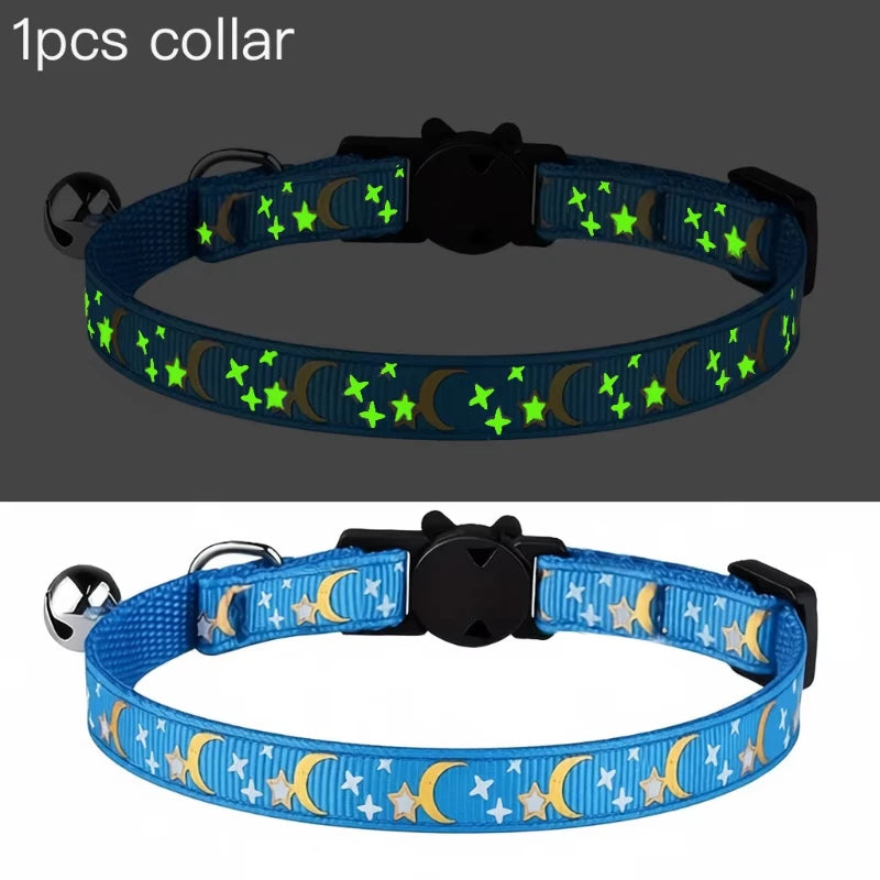 Blue glow-in-the-dark collar for pets featuring a celestial design and a small bell.