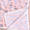 A pink flannel fleece pet blanket featuring a blue paw print pattern.