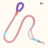 A pink adjustable hands-free dog leash with purple and orange accents.