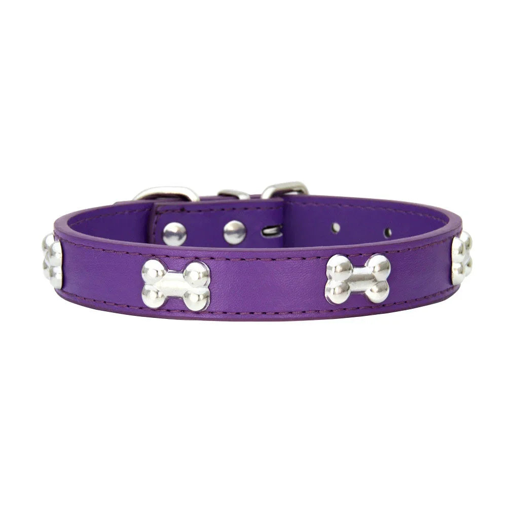 Purple padded leather dog collar with silver bone rivets and a buckle.