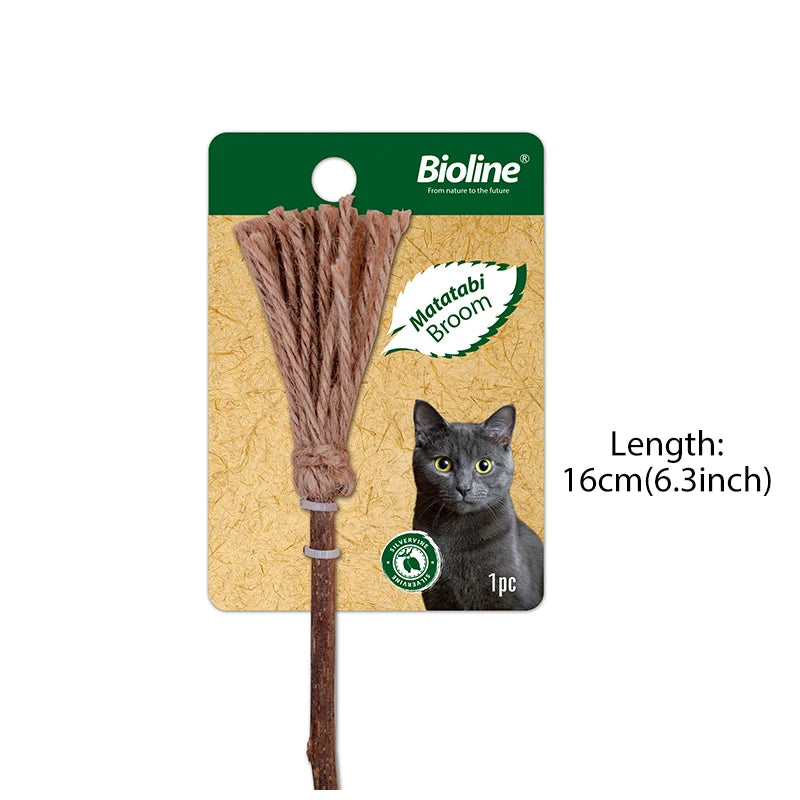 A brown Matatabi broom made of silvervine catnip is shown next to a black cat.