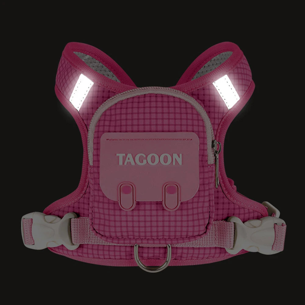 A pink pet backpack harness with a checkered pattern and illuminated light strips.