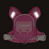 A pink pet backpack harness with a checkered pattern and illuminated light strips.