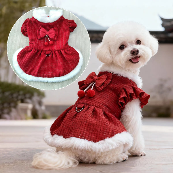 A fluffy white dog is wearing a red tweed dress with a bow and pom-pom trim, shown next to an inset detail of the garment.