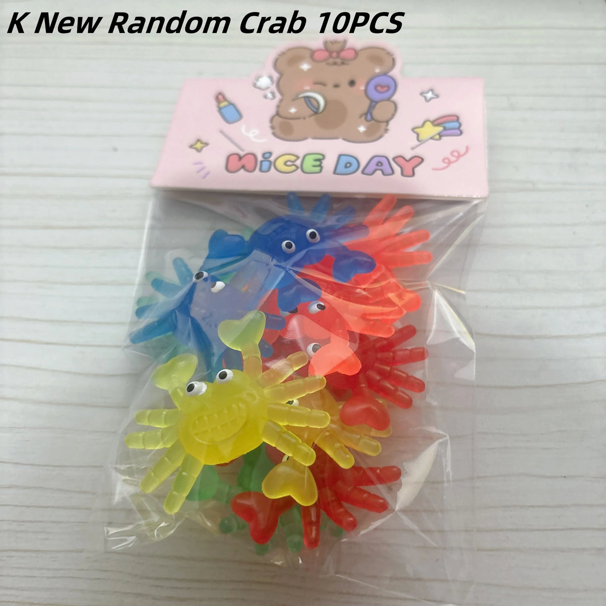 A clear plastic bag contains ten colorful rubber sea creatures and a pink card labeled Nice Day