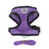 Purple pet harness and leash set with a silver emblem