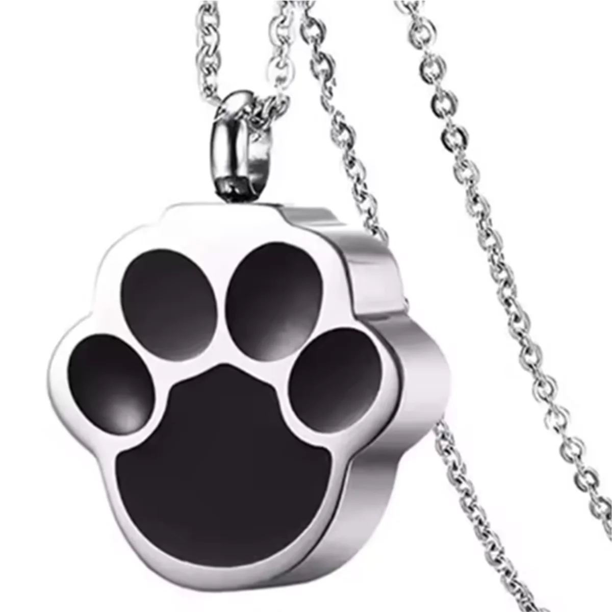 A silver stainless steel pet paw print memorial necklace hanging from a chain.