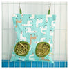 A light blue fabric bag filled with hay, featuring white and brown silhouette patterns of various animals.