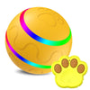 A bright yellow pet ball with glowing LED rings and a paw print design.