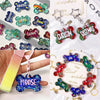 A collection of silicone dog bone molds in various colors and designs for resin casting.