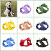 A collection of colorful reflective dog harnesses and vests in various shades including purple, green, yellow, and blue.