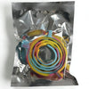A clear plastic bag contains an adjustable silicone pet collar in multiple bright colors like yellow, orange, and blue.