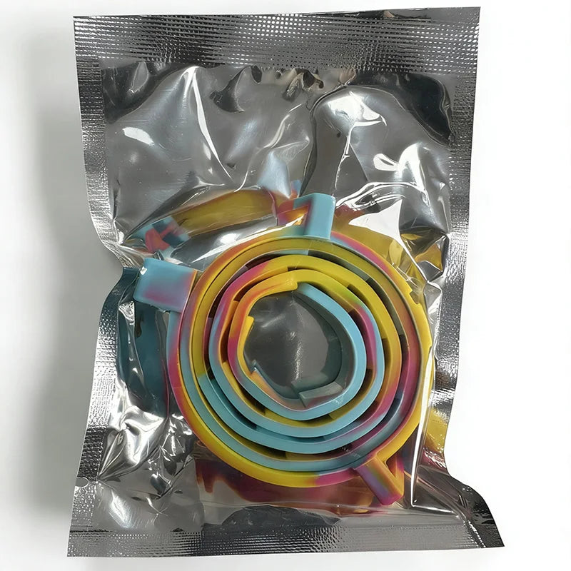 A clear plastic bag contains an adjustable silicone pet collar in multiple bright colors like yellow, orange, and blue.