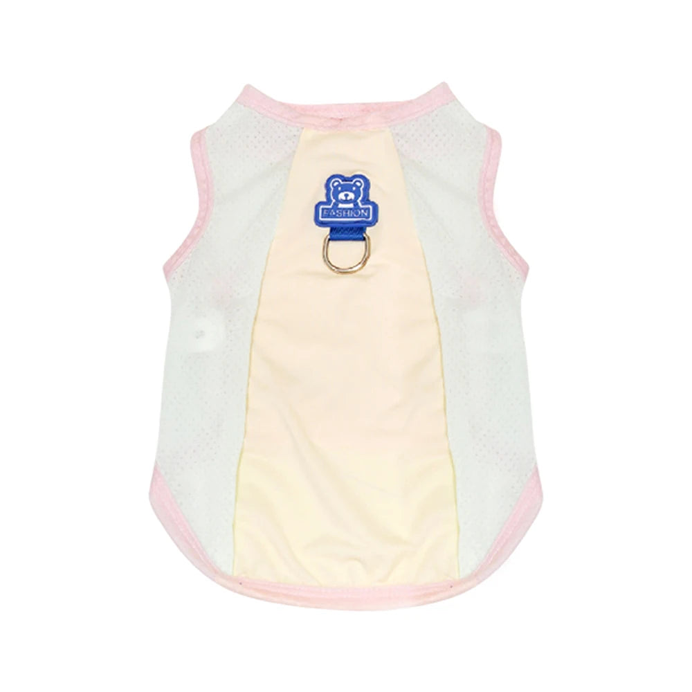 A white and pink cooling dog vest for summer with a blue and gold-ringed tag.