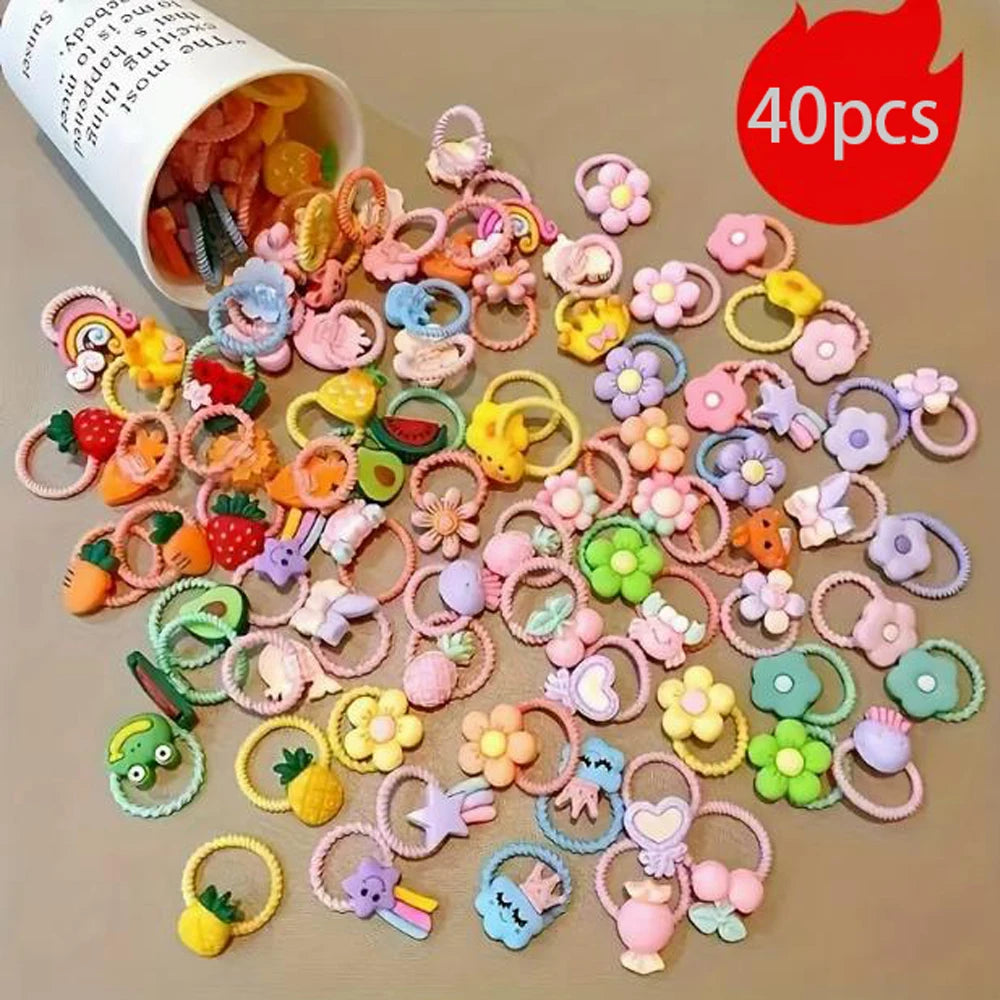 A collection of colorful elastic hair ties and accessories featuring cute cartoon characters for kids
