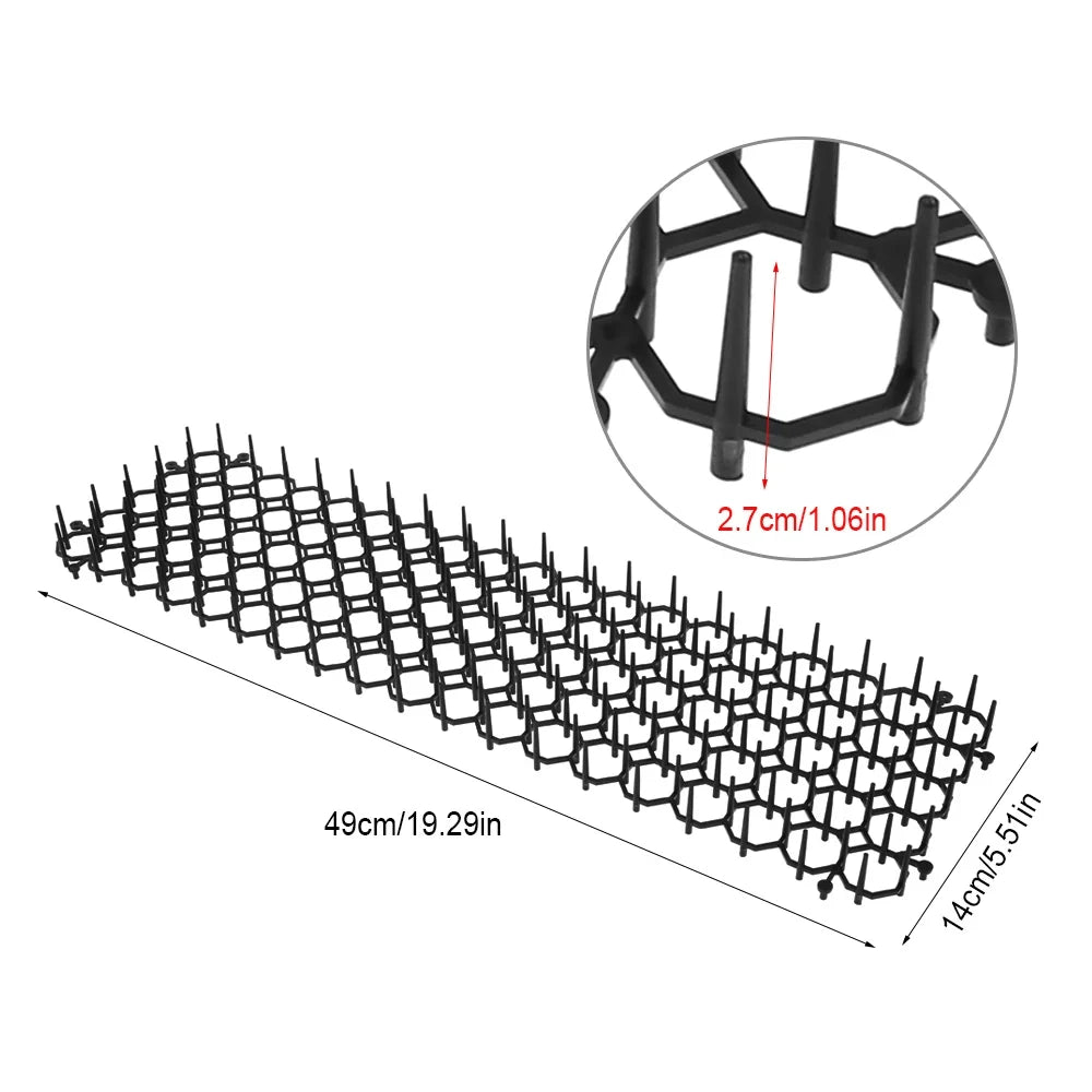 Black plastic prickle strips used as a pet deterrent for gardens and homes