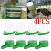 Four clear plastic clip-on feeders and waterers with green grips for small birds