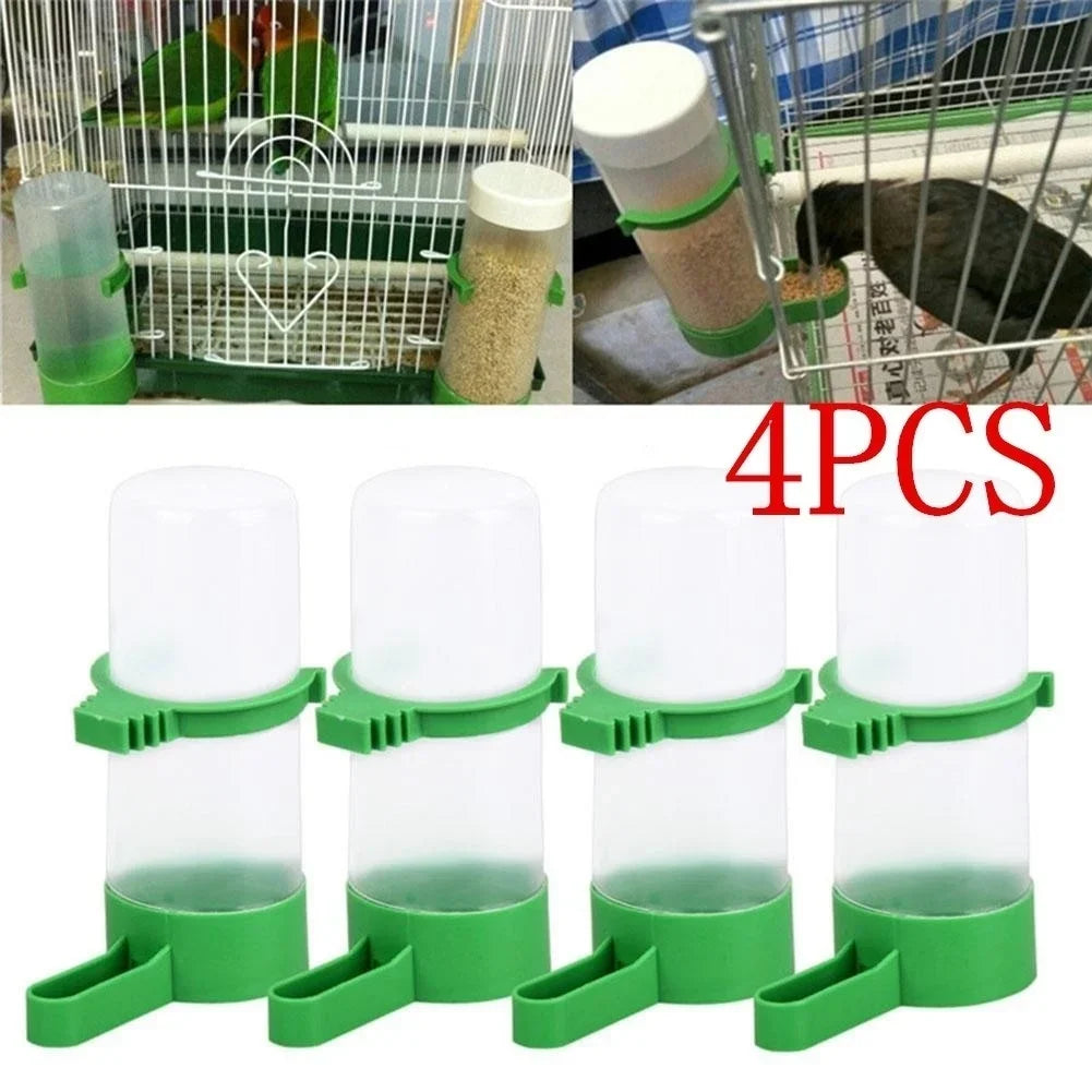 Four clear plastic clip-on feeders and waterers with green grips for small birds