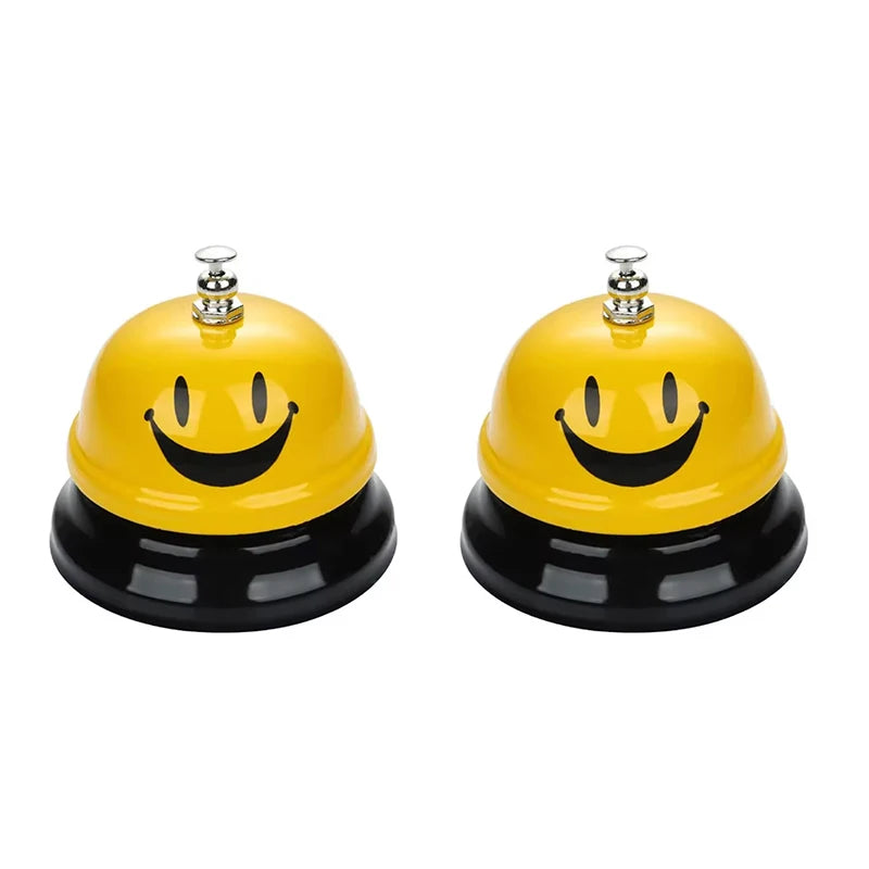 Yellow and black classic brass call bell with a smiling face design