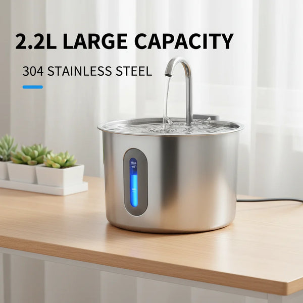 A stainless steel pet water fountain with a faucet is shown on a wooden surface.