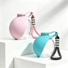 A pink glass portable dog water bottle with a silicone strap and a blue glass bottle with a black strap.