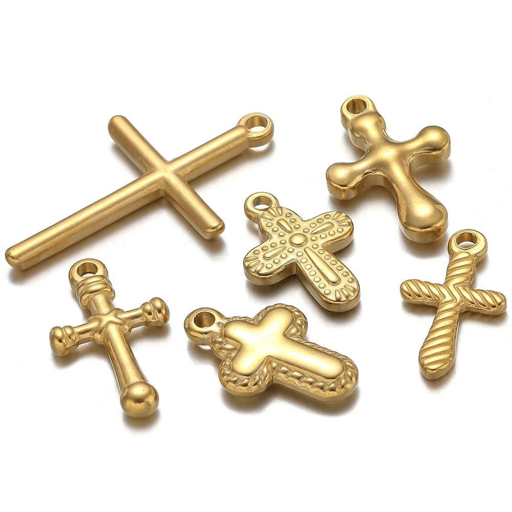 A set of vintage gold-toned cross charms for DIY jewelry making