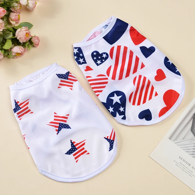 White and red patriotic dog vest featuring stars, stripes, hearts, and an American flag design.