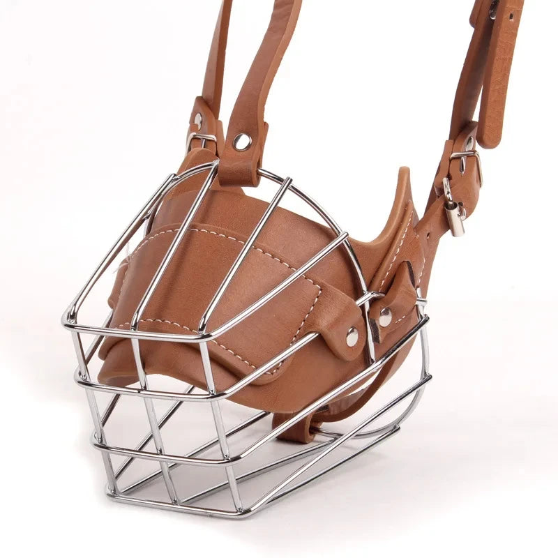A brown leather dog muzzle with a metal frame and adjustable leather straps.