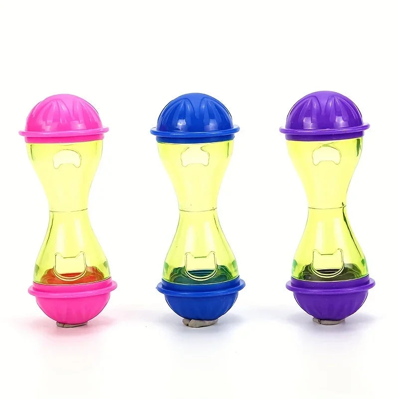 Tres juguetes de pelota para comedero interactivo para mascotas de colores: rosa, azul y morado.