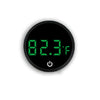 A round, black digital thermometer displaying 82.3°F with a power symbol on the bottom.