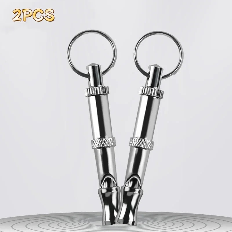 Two stainless steel adjustable ultrasonic dog training whistles with metal rings